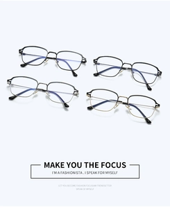 Detail view of four modern metal eyeglass frames in black, silver, gunmetal, and gold colors