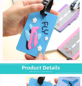 Detail of blue soft PVC luggage tag with 3D airplane design and FLY inscription