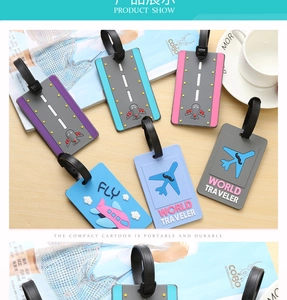 Flat lay of colorful PVC luggage tags with airplane patterns and adjustable black straps