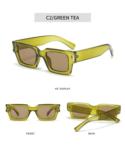 Detail view of transparent olive green rectangular sunglasses with brown lenses and silver trim