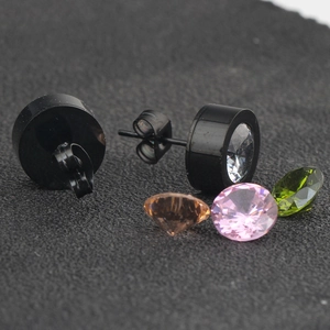 Macro shot of 11mm black stainless steel stud earrings with replaceable colorful zircons