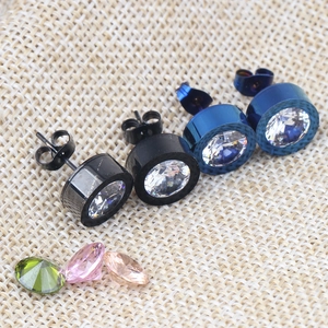 Detailed macro view of black and blue 11mm stainless steel stud earrings with cubic zirconia