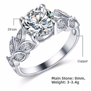 Macro detail of leaf-shaped ring with 8mm zircon stone set in silver-plated copper