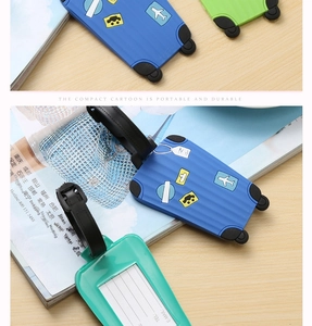 Detailed view of silicone cartoon suitcase luggage tag with contact info card and strap