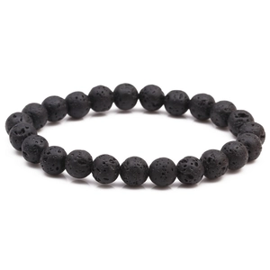 Macro view of natural 8mm black lava stone beads showing porous matte texture