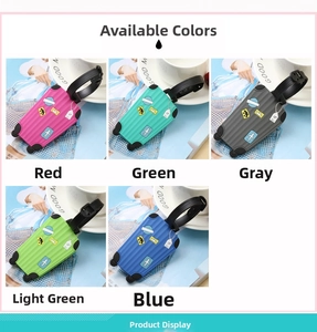 Detail showing colorful PVC suitcase luggage tags with airplane icons and adjustable straps