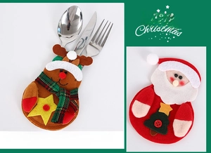 Detail of felt Christmas cutlery holders featuring Santa and reindeer holiday designs