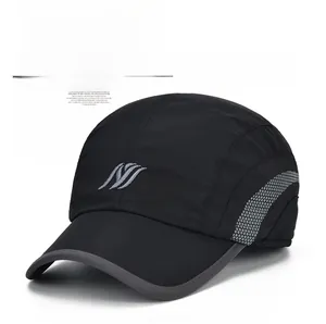 Detail of black winter baseball cap showing grey embroidered logo and breathable side mesh