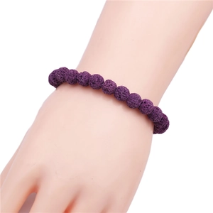 Detailed view of 8mm purple lava stone beaded bracelet showing natural porous texture