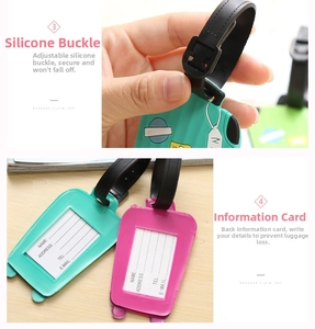 Detail showing adjustable silicone strap and contact information card on luggage tags