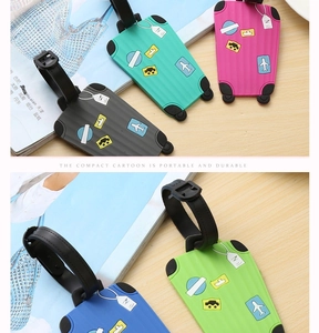 Detail of colorful mini suitcase luggage tags with airplane patterns and secure straps