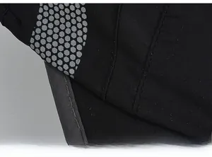 Detailed macro view of black winter hat fabric with honeycomb texture and double stitching