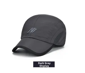 Close-up of dark grey baseball cap with side mesh vents and embroidered wave logo