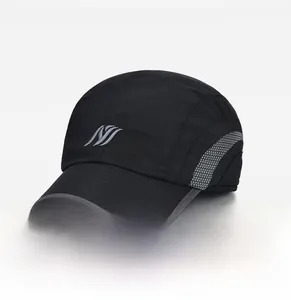 Close-up of black baseball cap featuring quick-dry fabric and grey linear logo detail