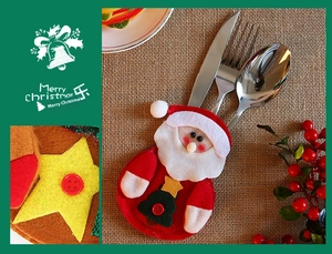 Detailed close-up of Santa Claus felt cutlery holder with star and button decorations