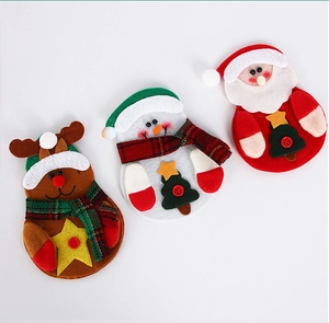 Detail of Christmas snowman reindeer and Santa cutlery holders made of felt fabric