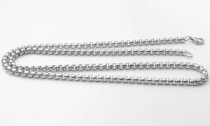 Macro shot of 3mm silver stainless steel box chain necklace with durable lobster clasp