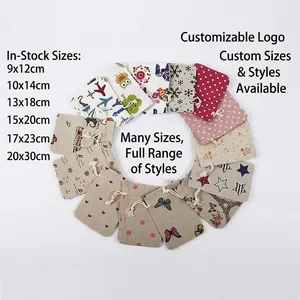 Various sizes of cotton drawstring pouches with butterfly and floral prints on white backdrop