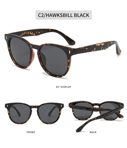 Detailed views of vintage tortoiseshell sunglasses with dark lenses and durable frames