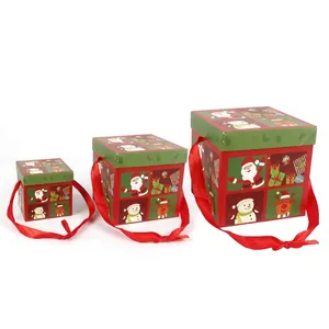Three-piece Christmas gift boxes set with festive Santa Claus patterns and red ribbon handles
