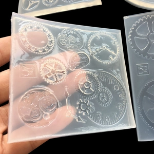 Translucent silicone mold featuring industrial steampunk gear designs and mechanical parts