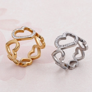 Elegant gold and silver heart rings with sparkling crystals for a sophisticated look