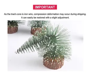 Detail of mini snowy Christmas tree with green needles and a rustic wooden round base