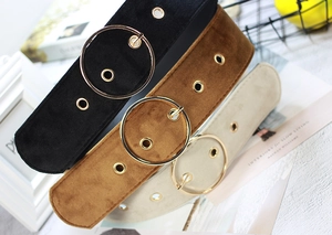 Three velvet waist belts in black, brown and beige with large golden round buckles