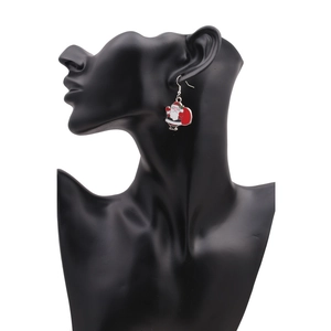 Detail shot of acrylic Santa Claus earrings with cool sunglasses on a black model head