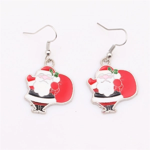 Detailed macro shot of acrylic Santa Claus earrings with colorful enamel finish