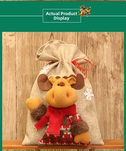 Detail of burlap Christmas gift bag featuring a 3D plush reindeer with knitted scarf