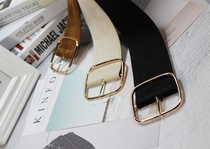 Three velvet waist belts in camel, beige, and black colors with square gold buckles
