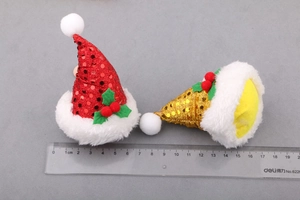 Close-up of DIY sequined Christmas hats for hair accessories with ruler for size scale