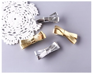 Set van 4 metallic gouden en zilveren strik-haarclips met textuur voor meisjes