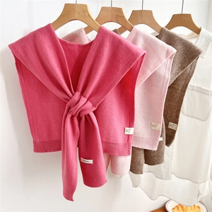 Knitted 100% wool shawl for women with ribbed trim and knotted front in solid colors