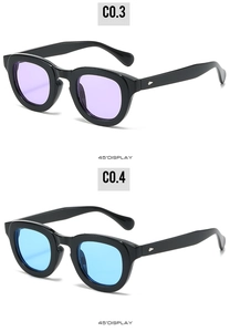 Detail view of oval thick-frame sunglasses with purple and blue lenses at a 45-degree angle