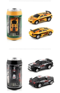 Detail view of yellow and black mini remote control cars inside clear soda can packaging