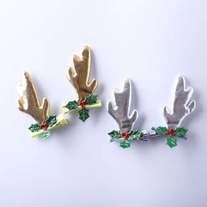 Barrettes bois de renne de Noël dorées et argentées avec paillettes et baies rouges