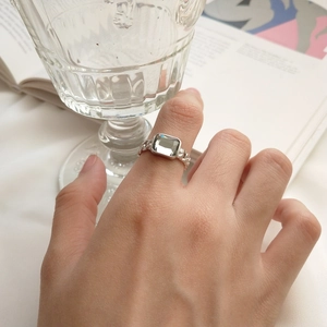 Detailed close-up of a S925 sterling silver chain ring with a rectangular cubic zirconia