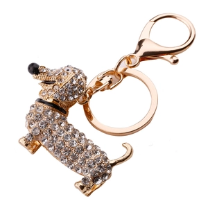 Detail of golden dachshund keychain featuring sparkling clear crystals and spring hook