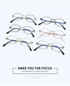 Detailed grid of six small oval metal glasses frames in gold, silver, and black finishes