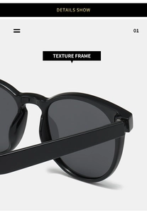 Detail view of the sleek black texture frame and hinge of these polaroid sunglasses
