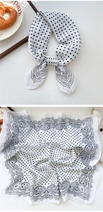 Detail of black and white paisley cotton square scarf with polka dots and intricate patterns