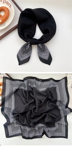 Close-up of black and white Paisley square scarf showing premium fabric texture
