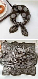 Detailed pattern of brown paisley cotton silk scarf with mandala floral prints