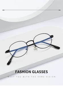 Detailed view of black metal oval frames with blue light blocking lenses on a white pedestal