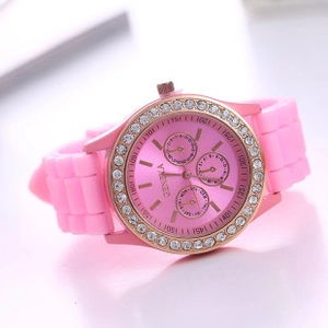 Detailed macro of a pink Geneva silicone watch with rose gold rhinestone bezel and sub-dials