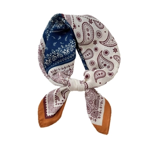Classic paisley print square silk scarf in navy blue and cream with a center knot