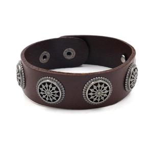 Brown leather cuff bracelet for men featuring silver metal rivets and buckle closure