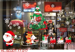 Detailed Christmas window decals showing Santa's sleigh, gift train and white snowflakes